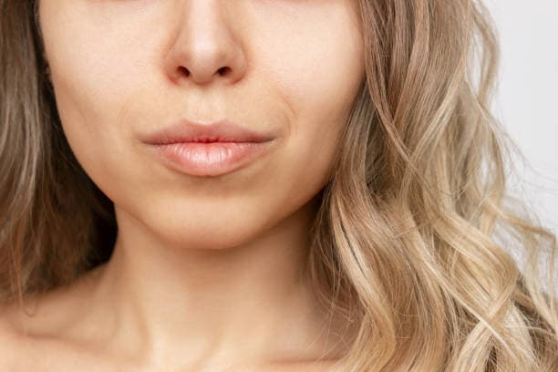 What are the risks associated with buccal fat removal surgery?